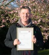 Steve Reed, Container Division Production Director at Wyevale Nurseries, with the Environmental Management System – ISO 14001 certificate. 